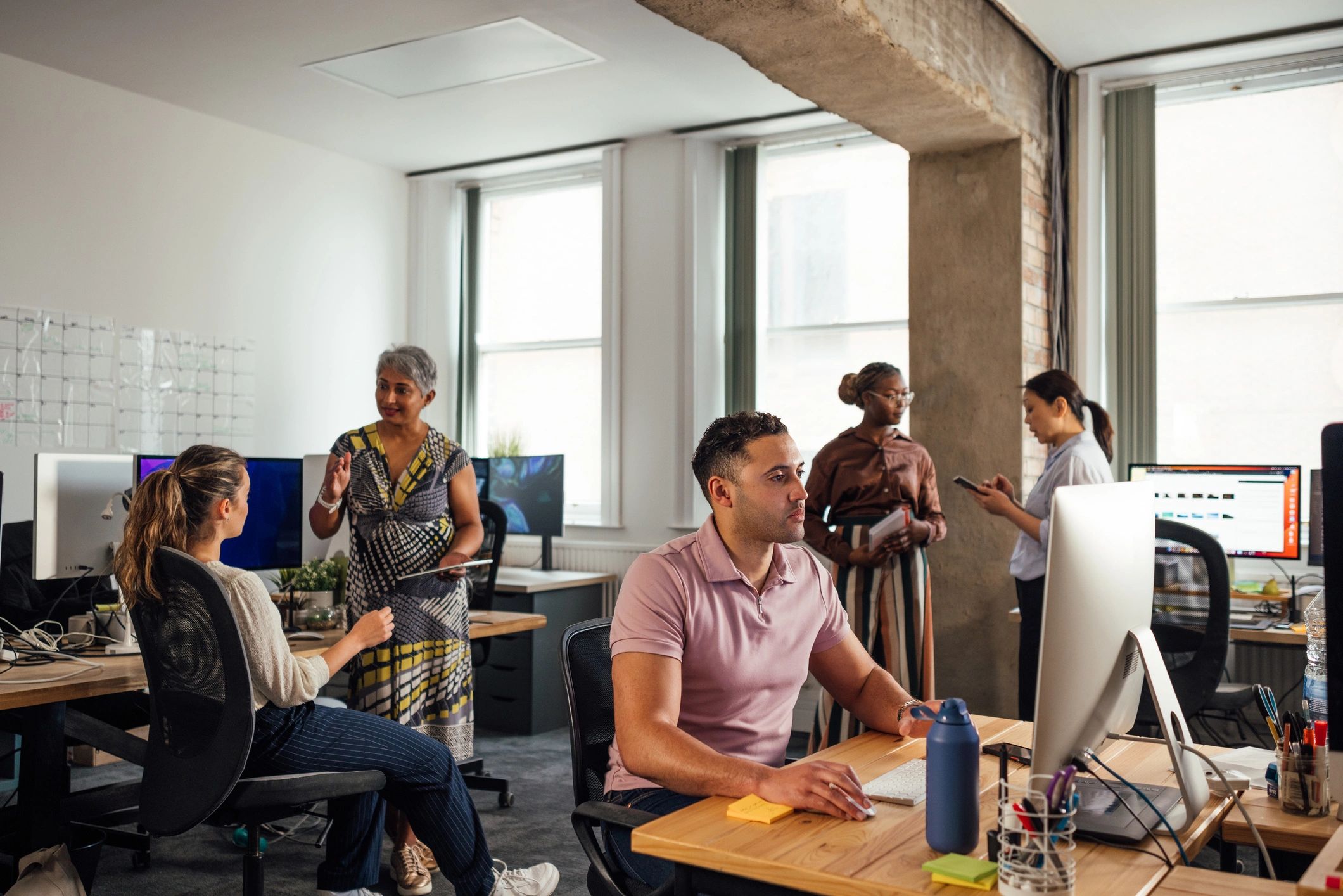 Technology team collaborating in a modern office
