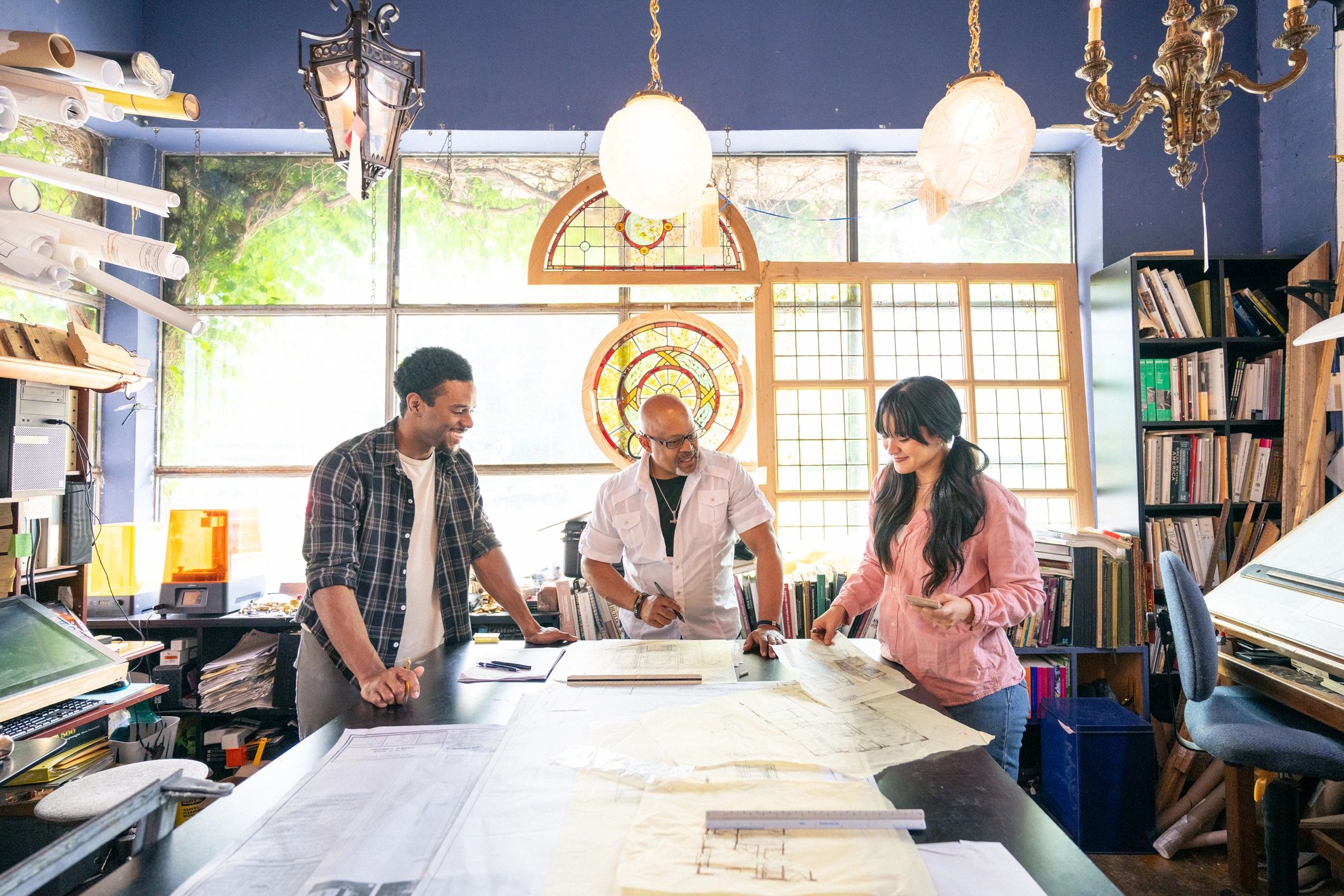 Engineering team collaborating on a project in a studio